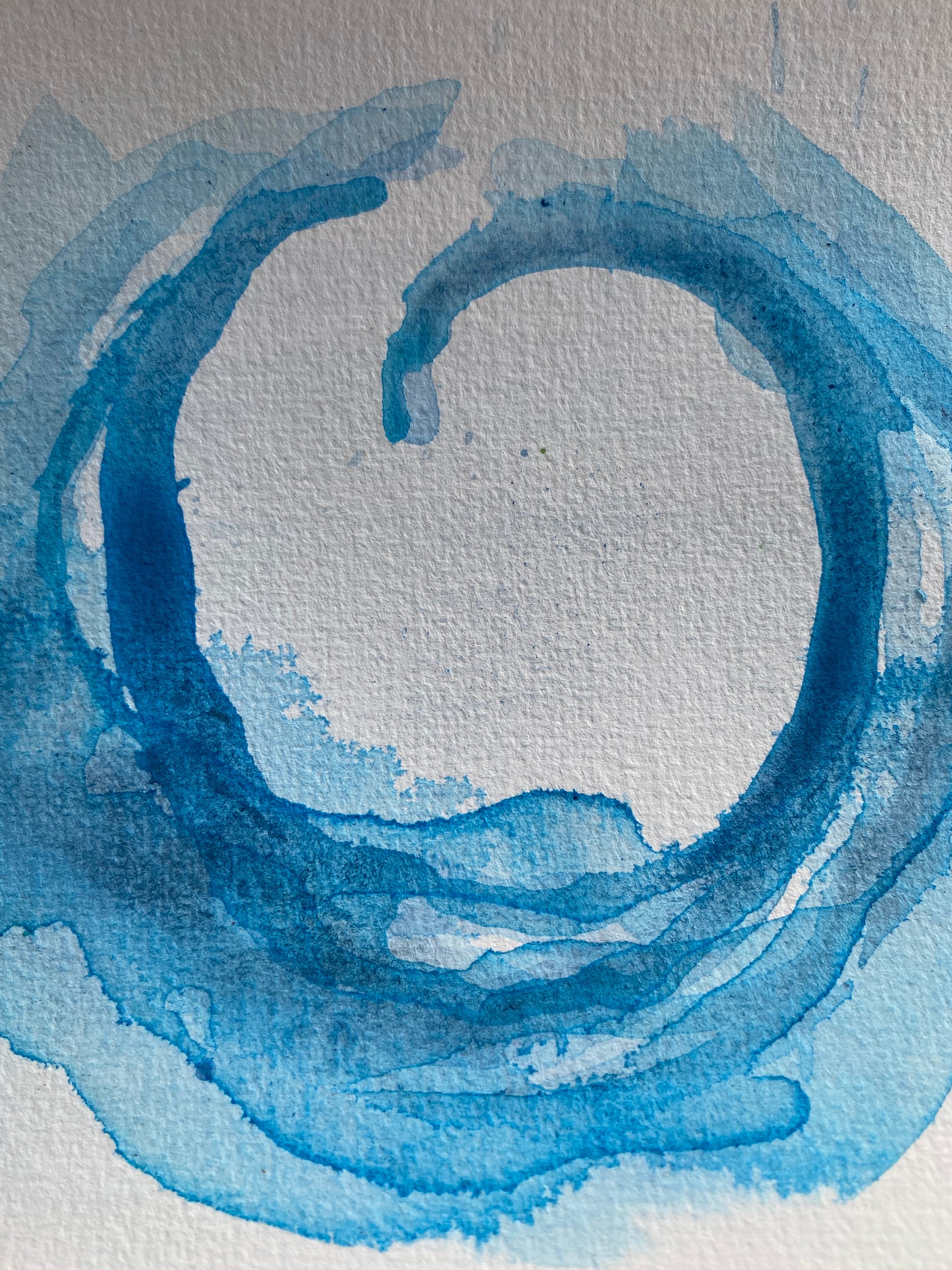 Blue watercolor wave on textured white paper